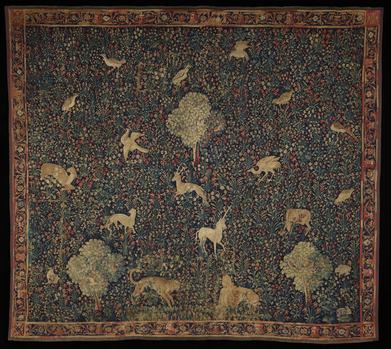 Allegorisch Millefleurs wandtapijt met dieren (1530-45) door Flemish School