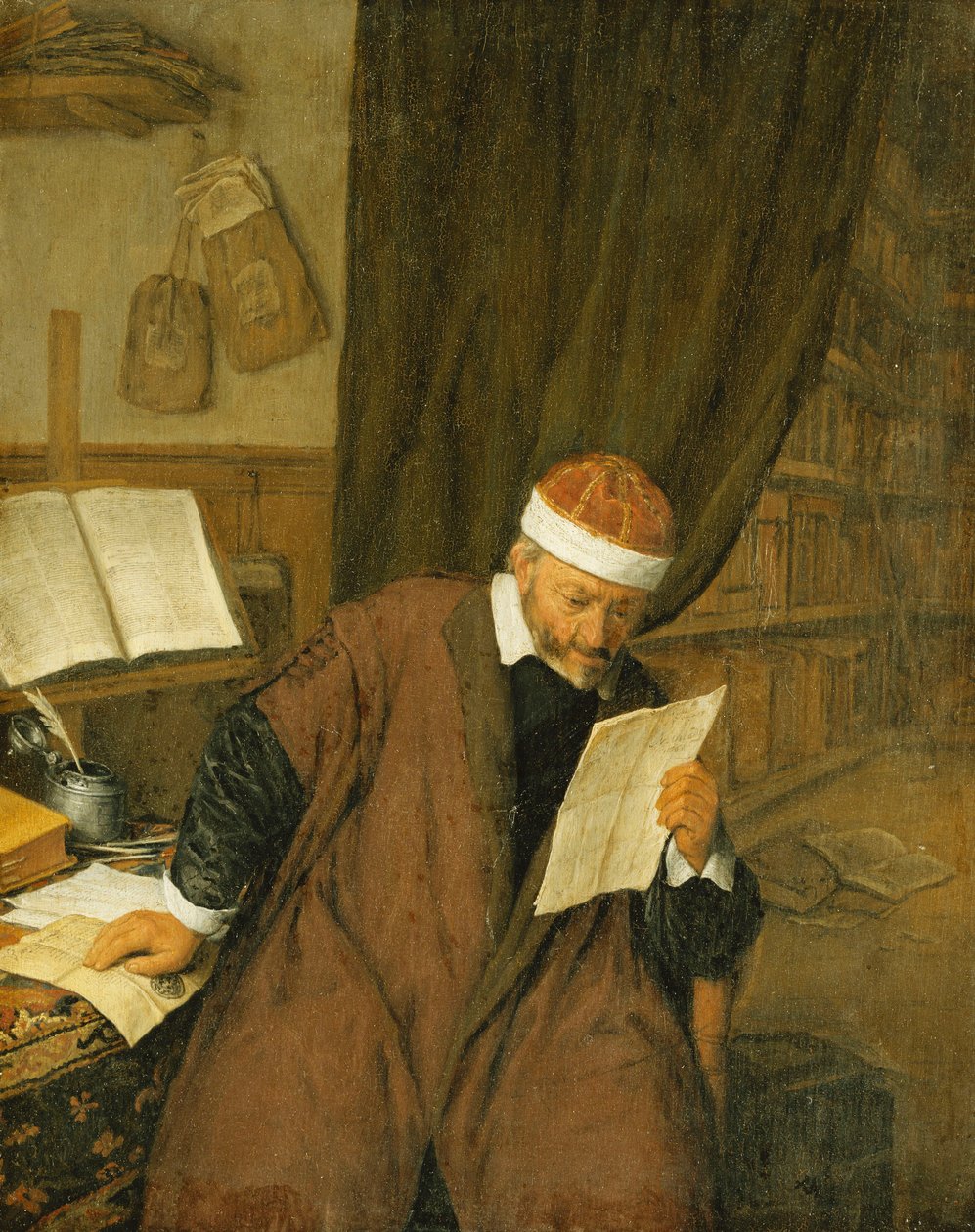 Een advocaat zittend aan een bureau die een brief leest, een bibliotheek daarachter, 1668 door Adriaen Jansz. van Ostade