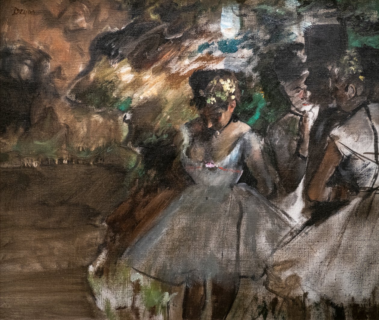 Drie dansers achter de schermen door Edgar Degas
