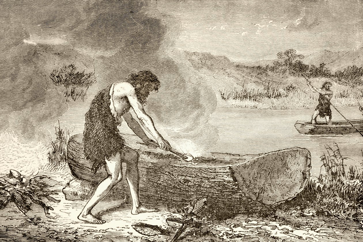 Een prehistorische man die vuur gebruikt om een kano uit een boomstam te maken door English School