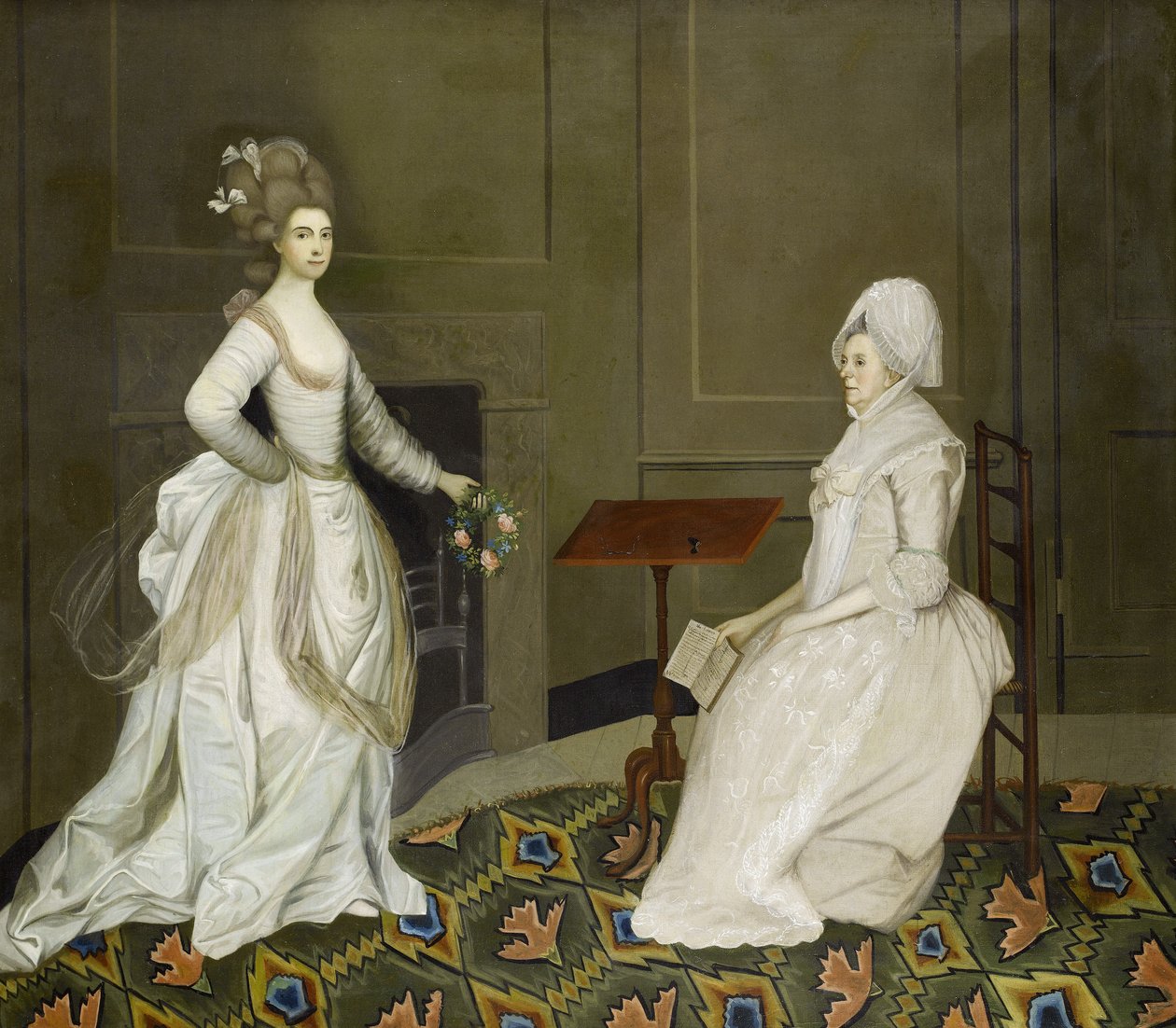 Twee dames in een interieur, een lezend, de ander met een bloemenkrans door English School, 18th Century