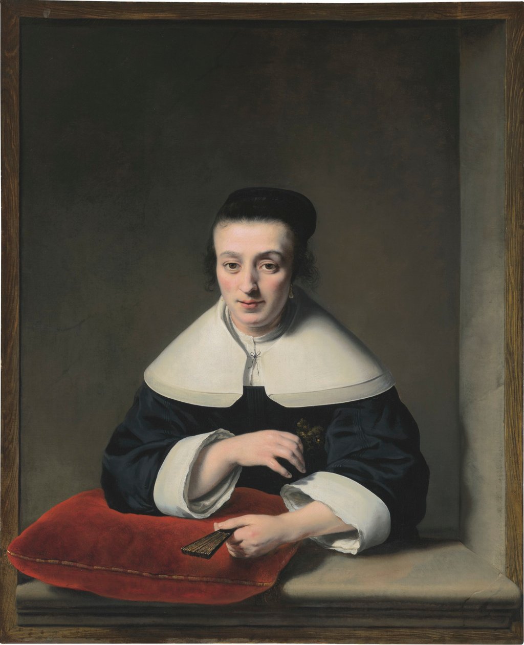 Portret van een dame bij een raam door Ferdinand Bol