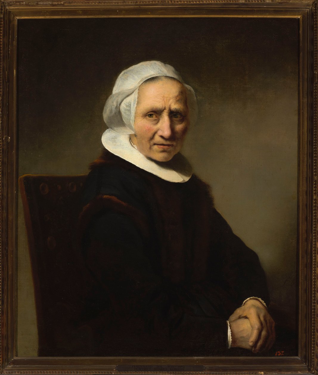 Portret van een oude vrouw met een witte muts door Ferdinand Bol