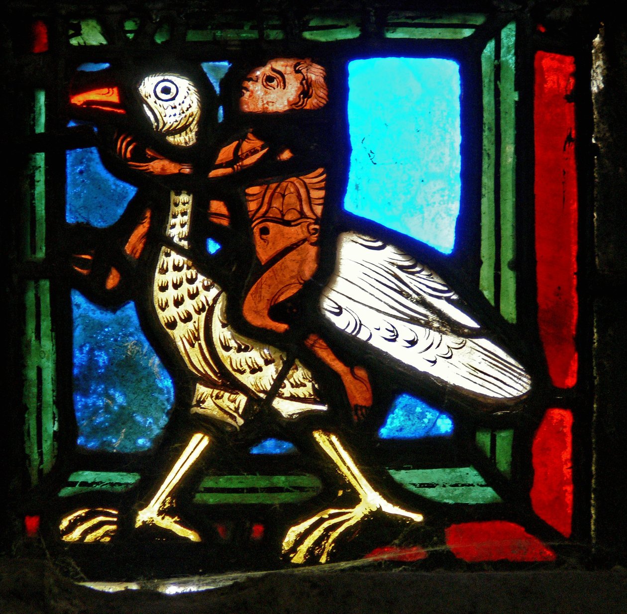 Hoekstuk (man en vogel) uit een raam van de gelijkenis van de Barmhartige Samaritaan door French School