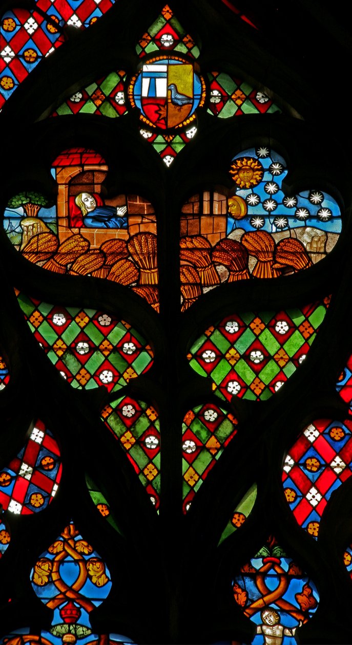 Een tracery licht met Jozef die droomt van de zon, maan en sterren, en dat de schoven van zijn broers voor hem buigen door French School