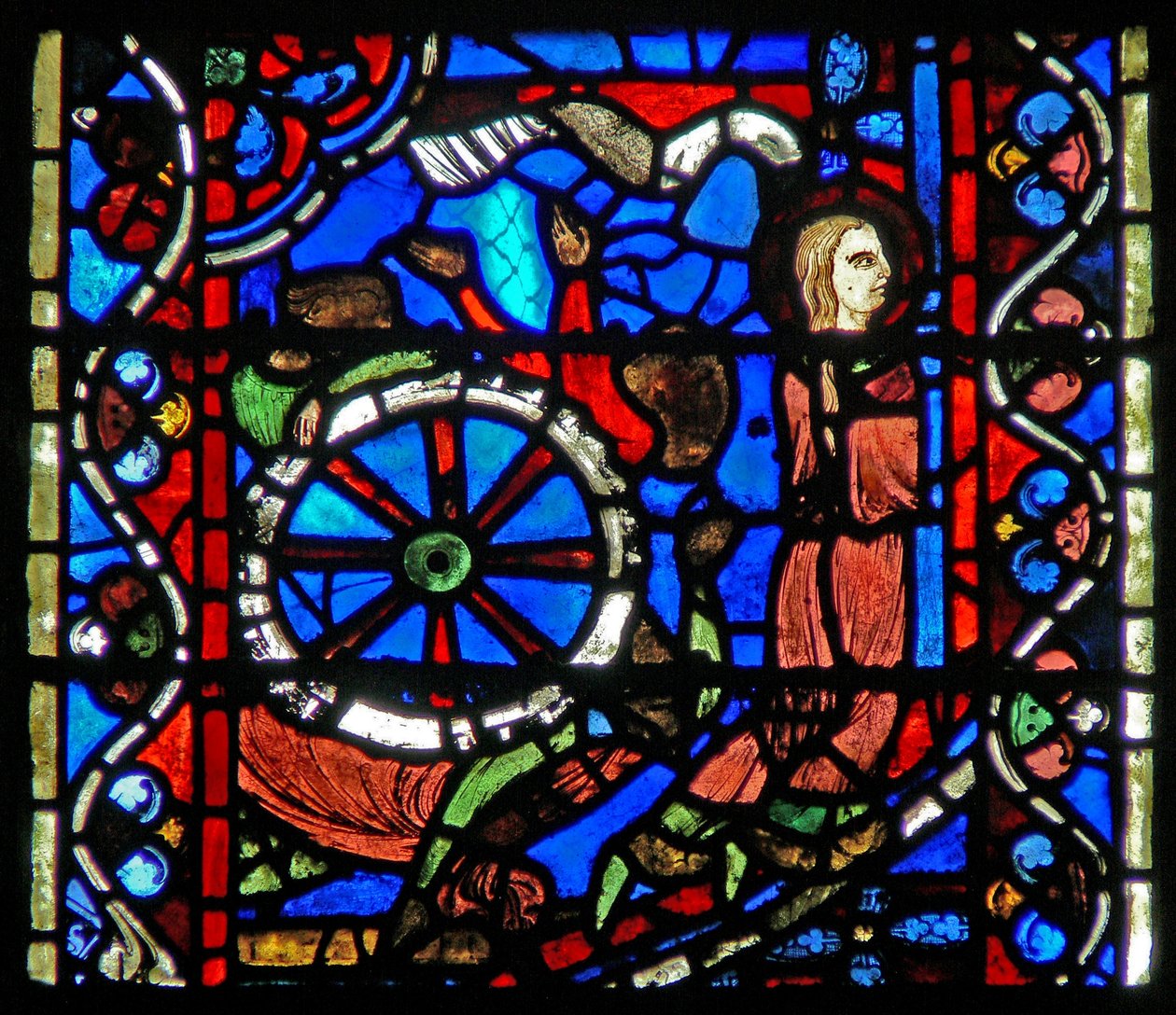 Raam w53 met afbeelding van een scène uit het leven van St. Catharina: de beulen bereiden het wiel voor haar beproeving voor door French School