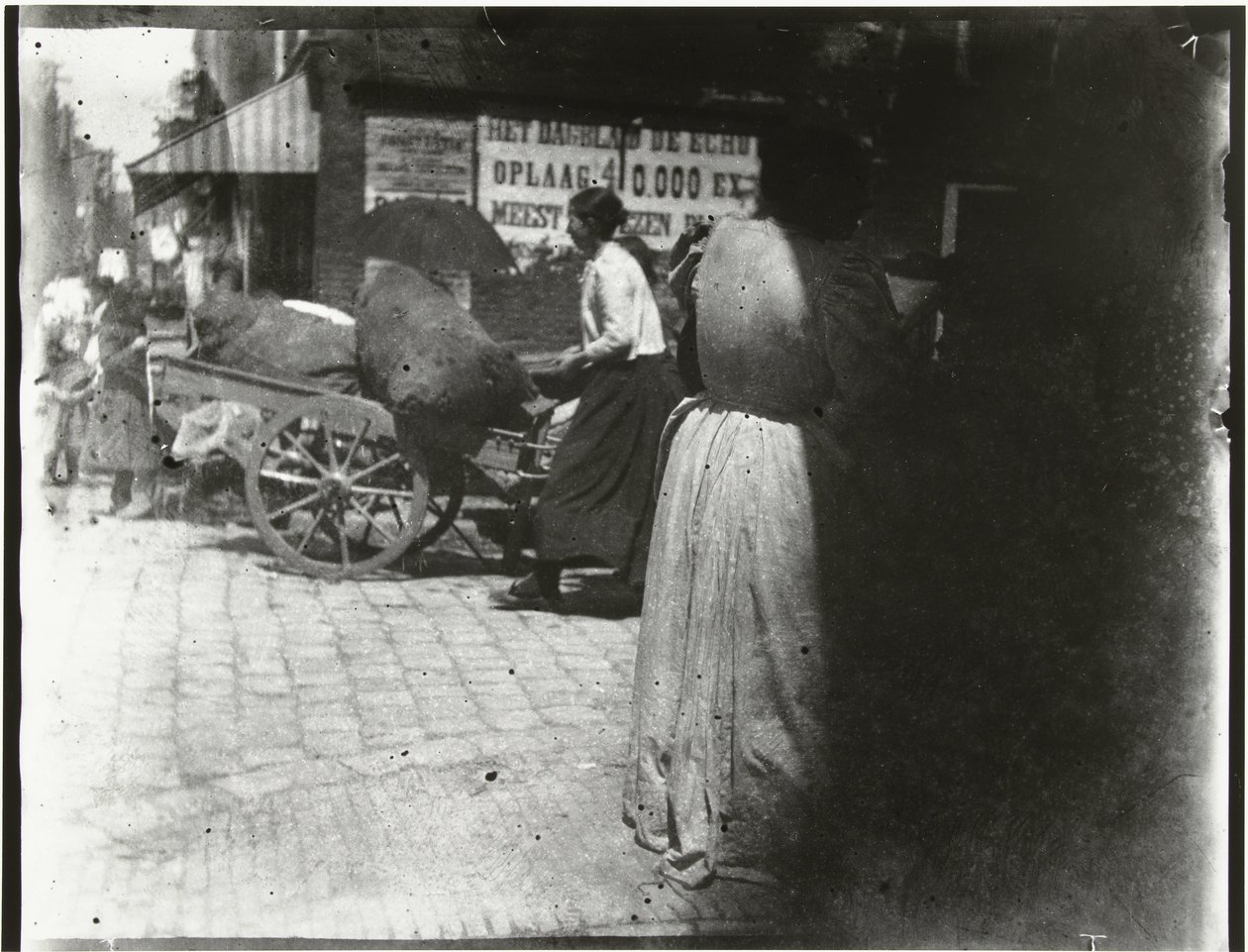 Bedrijvigheid in de Houtkopersdwarsstraat en de Jodenbreestraat in Amsterdam door George Hendrik Breitner