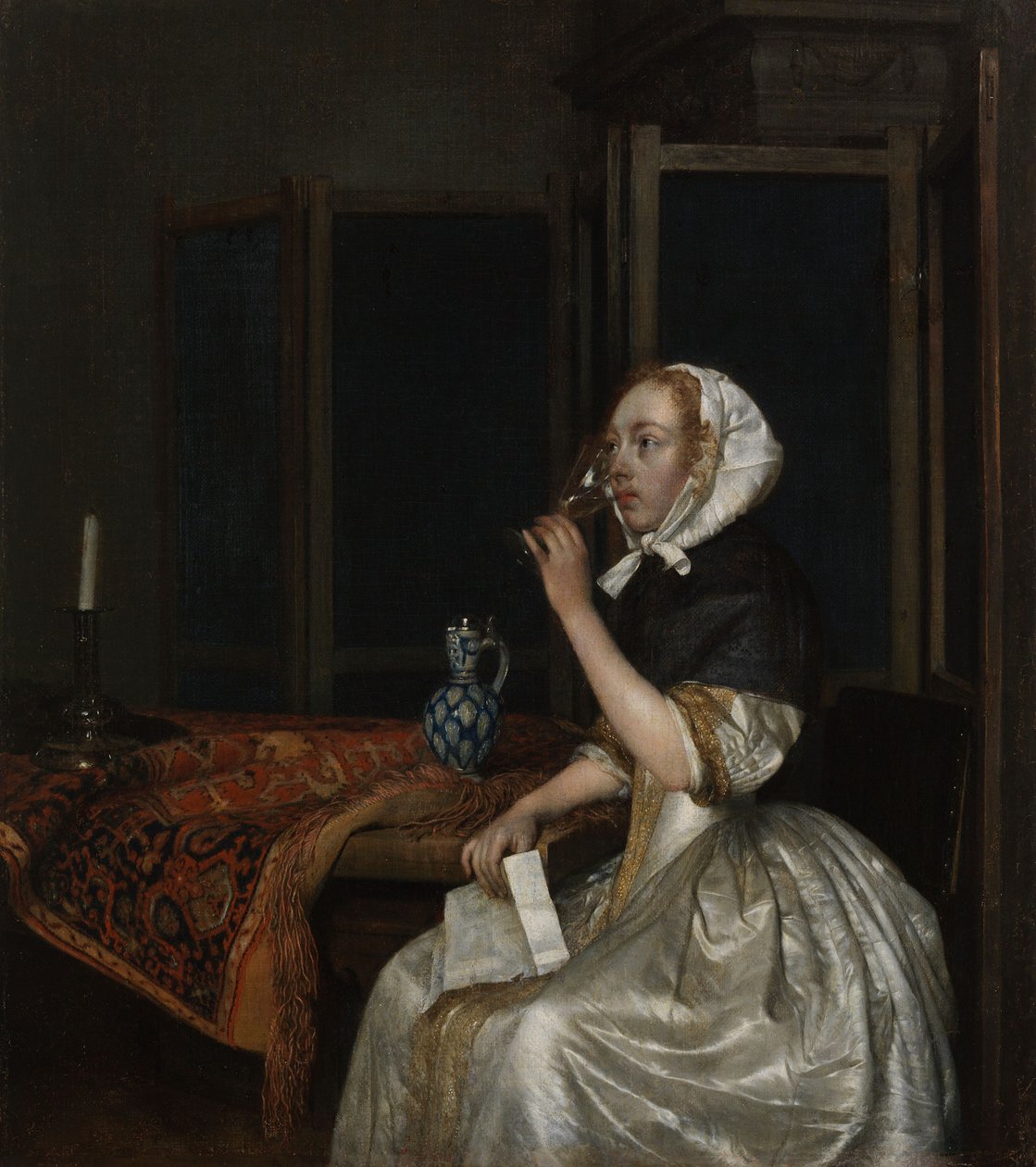 Jonge vrouw met een glas wijn, met een brief in haar hand door Gerard ter Borch