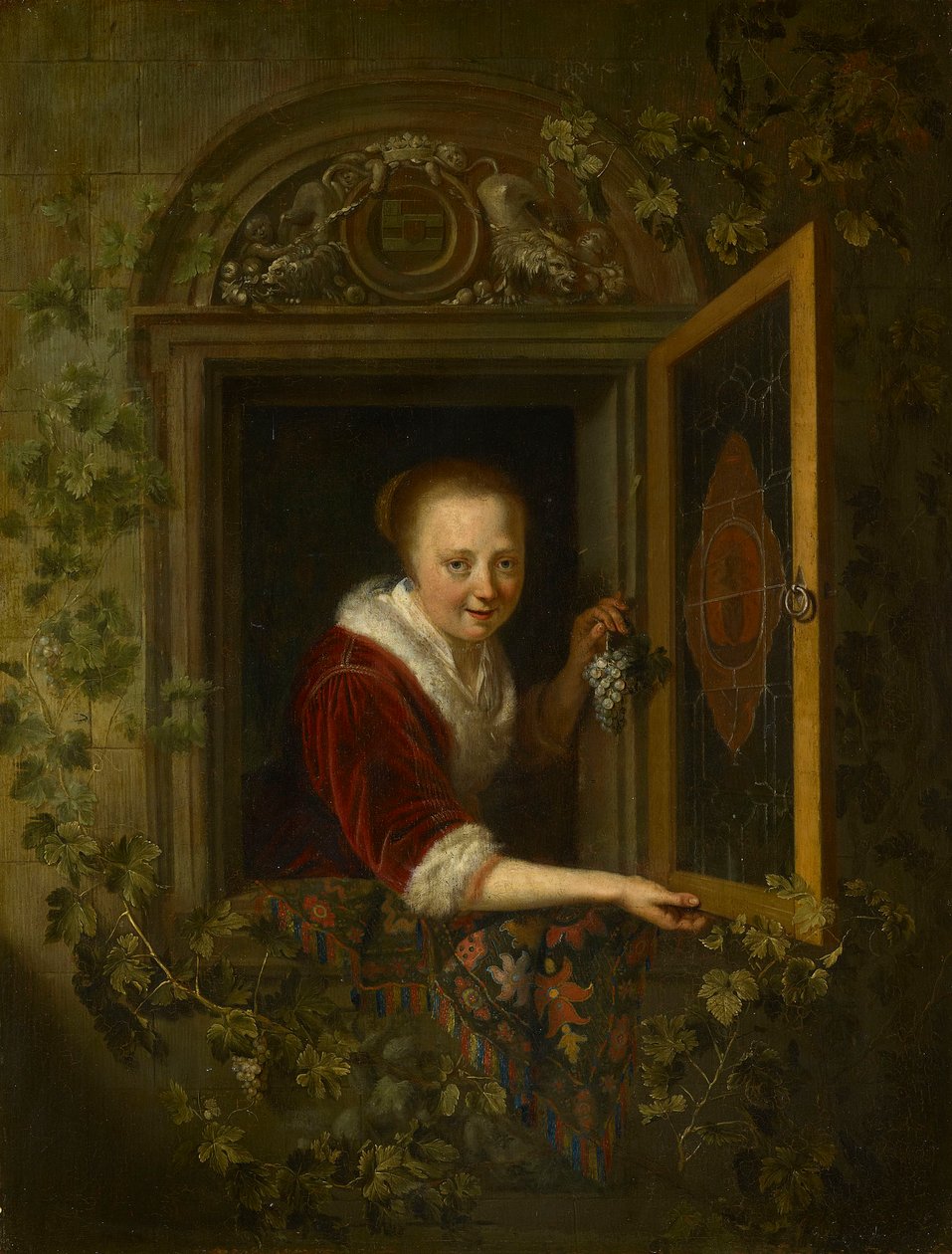 Een meisje met een druiventros bij een raam door Gerrit Dou