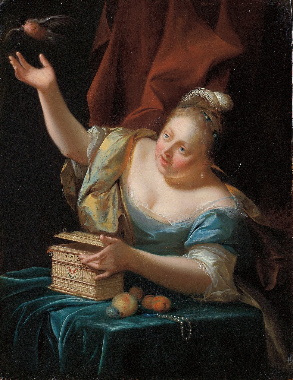 Een vrouw, zittend aan een tafel in fantasiekostuum, die een zangvogel uit zijn kooi bevrijdt door Godfried Schalcken