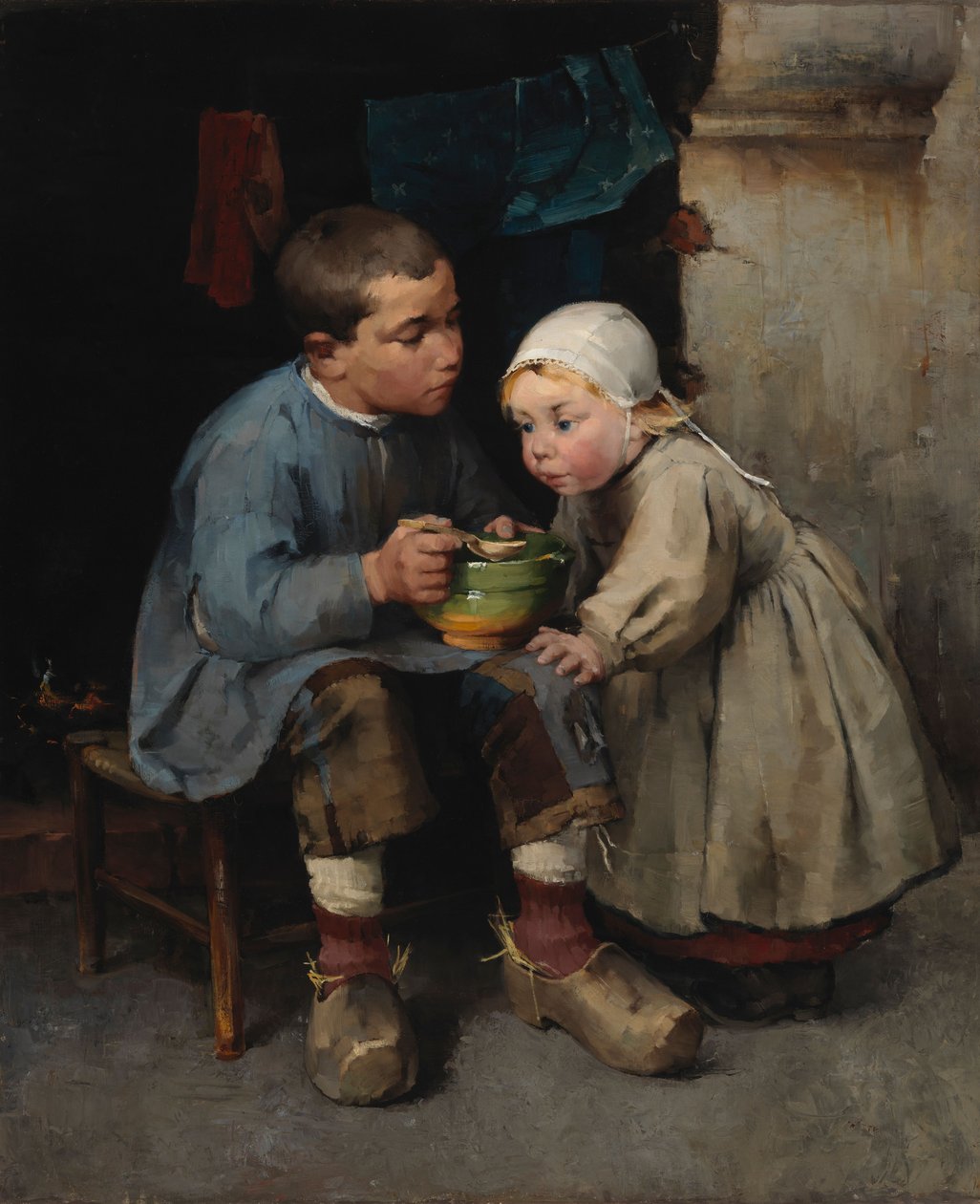 Een jongen die zijn zusje te eten geeft door Helene Schjerfbeck