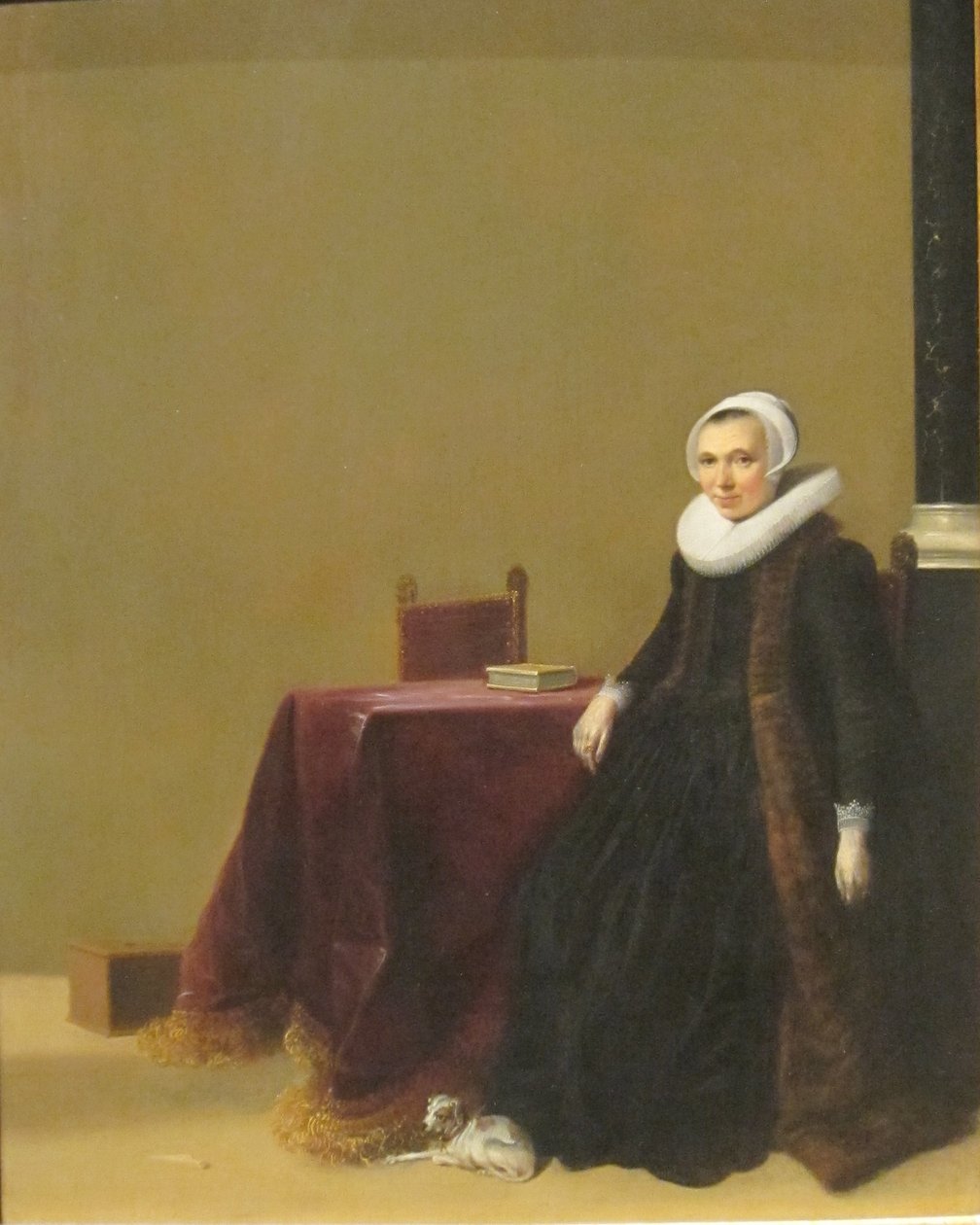 Portret van een vrouw met een hond door Hendrik Gerritsz Pot
