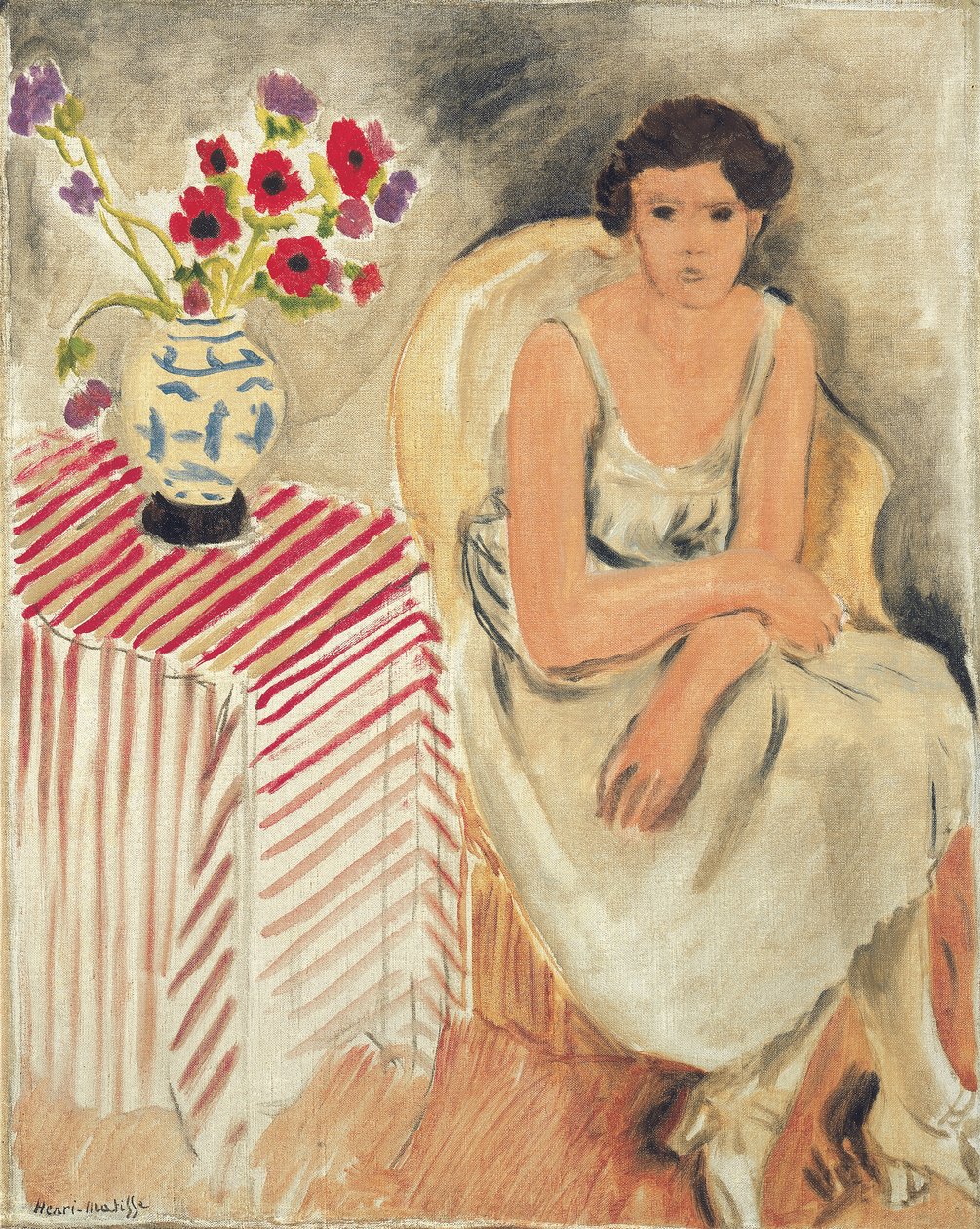 Vrouw op een stoel - Bloemen op tafel, of anjers door Henri Matisse