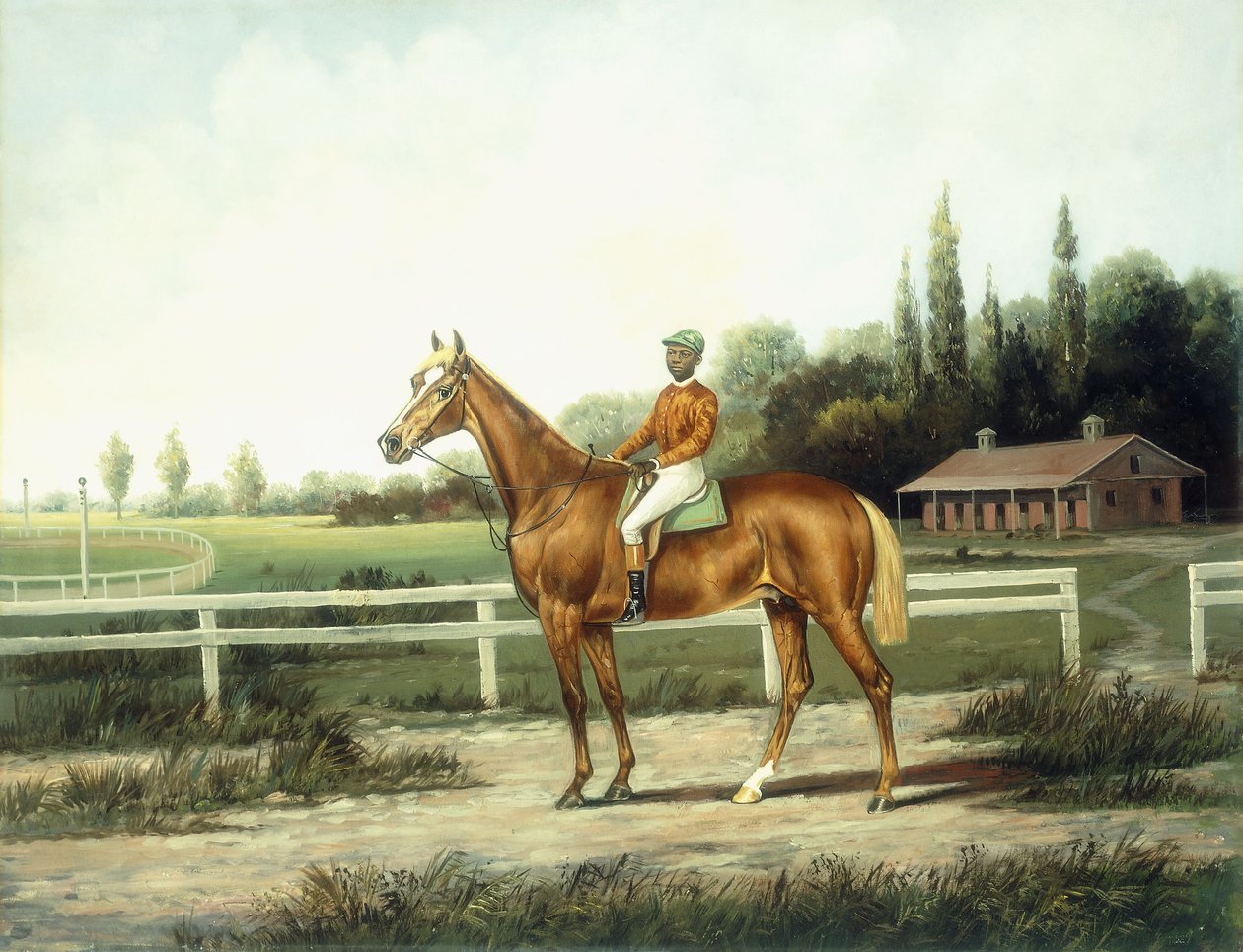 Een kastanjebruin renpaard met jockey op een trainingsbaan met stallen op de achtergrond door Henry H. Cross