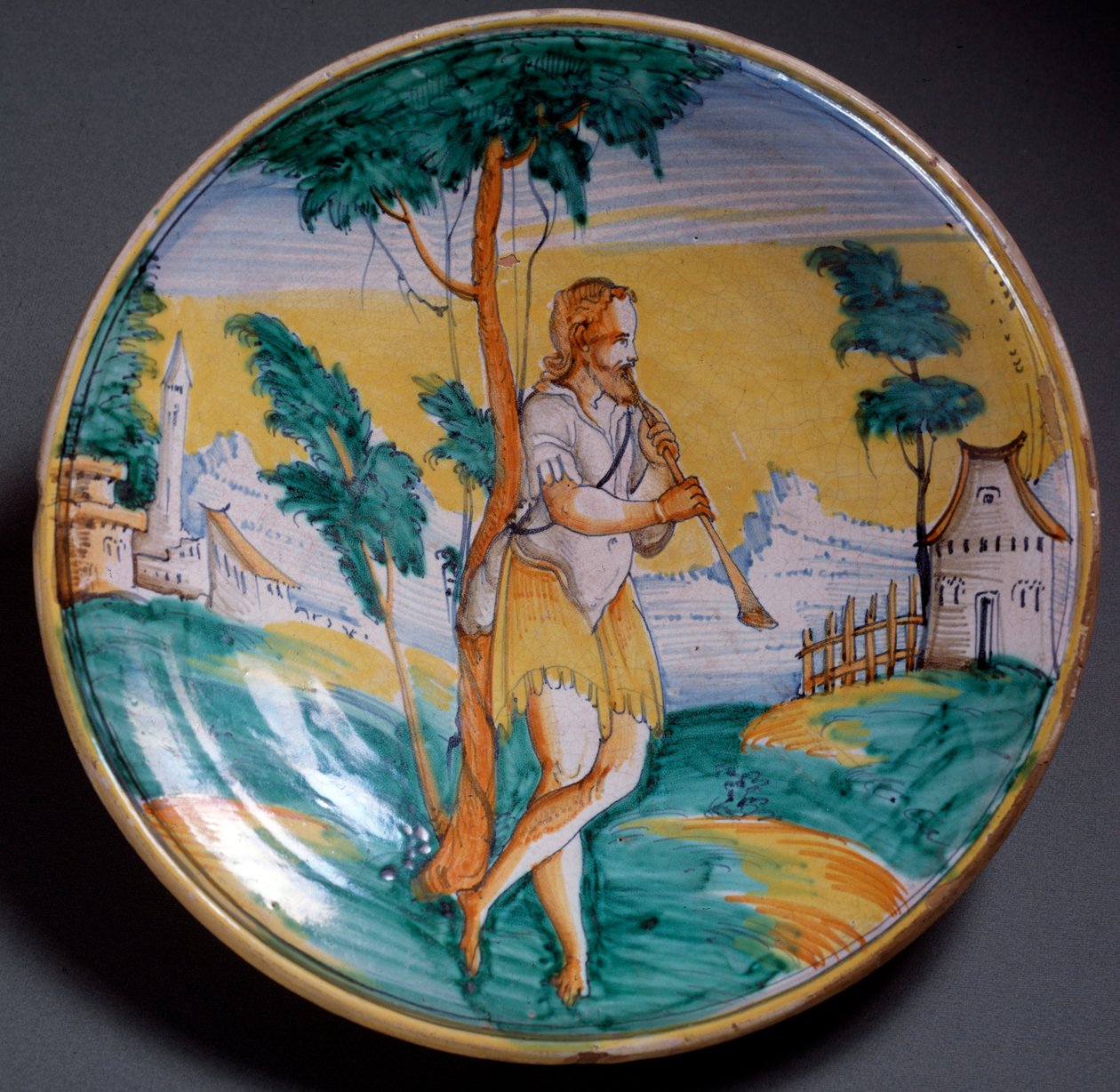 Renaissance kunst: bord versierd met een fluitspeler - Eind 16e eeuw Productie van Viterbo, Italië Florence, Museo Nazionale del Bargello door Italian School