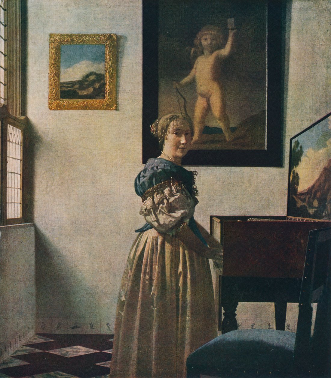 Een jonge vrouw staand bij een virginaal, circa 1670-1672 door Jan Vermeer van Delft