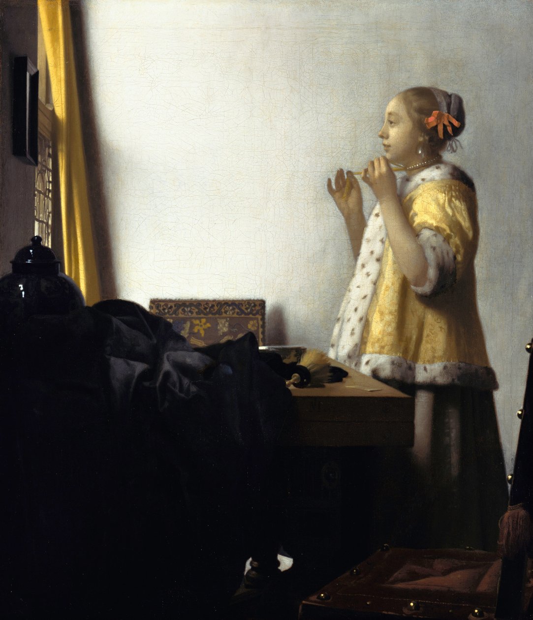 Jonge vrouw met parelketting door Johannes Vermeer