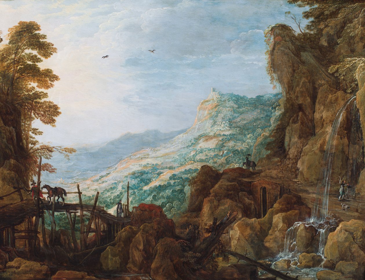 Een rotsachtig berglandschap met een ruiter op een brug en een waterval (olieverf op paneel) door Joos or Josse de The Younger Momper