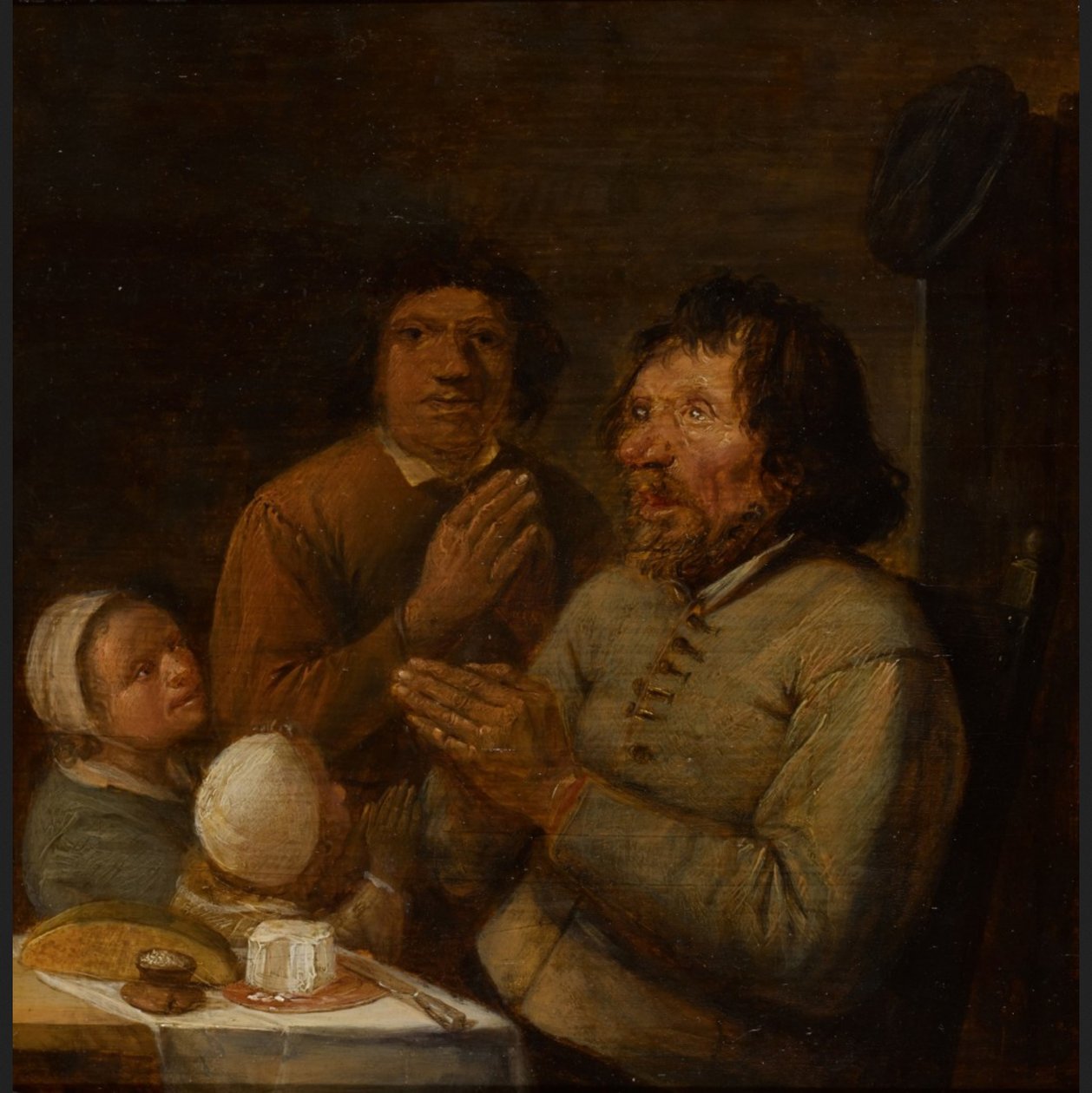 Interieur met een biddende boerenfamilie door Joos van Craesbeeck