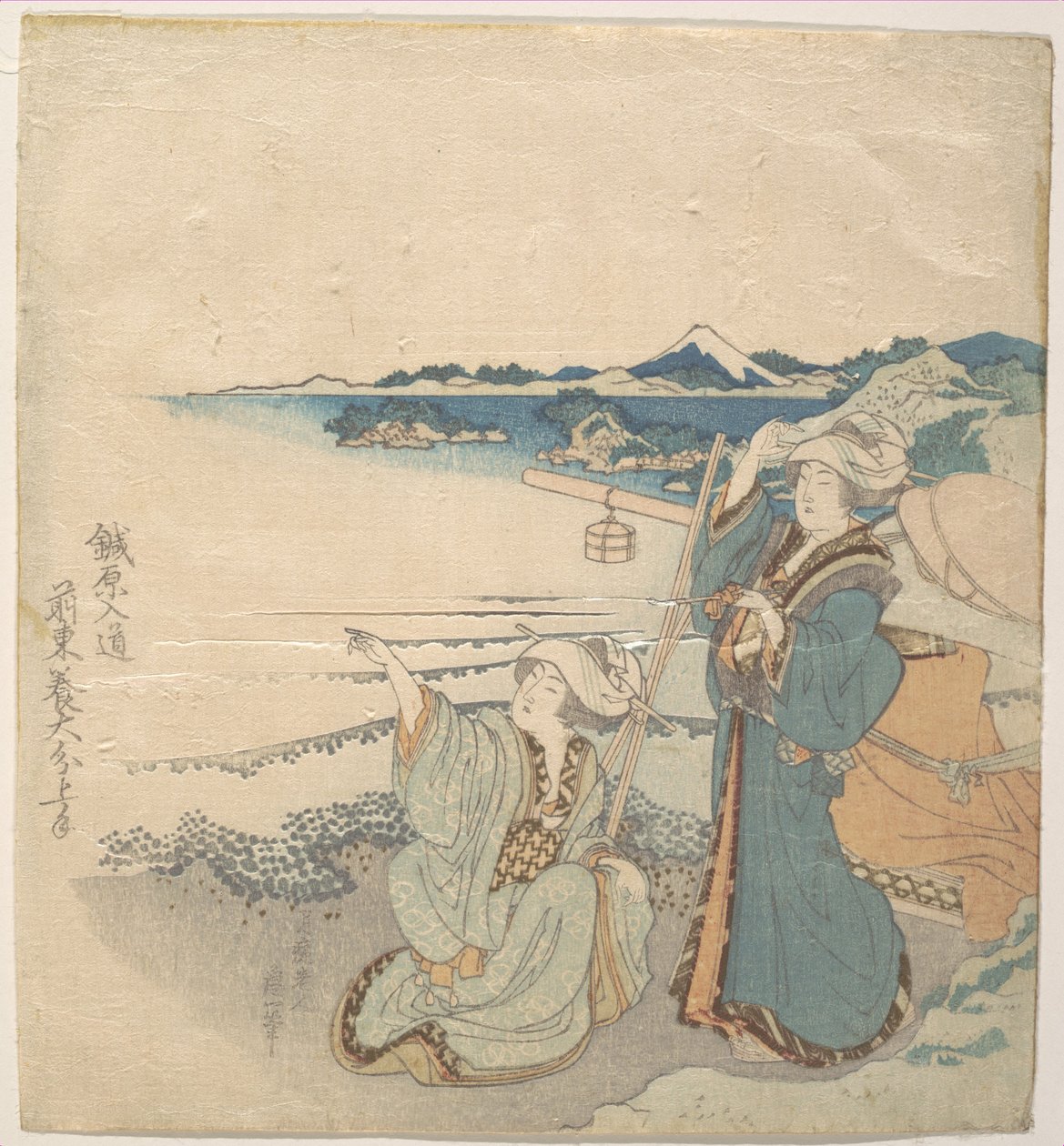 Twee jonge dames aan de kust; één wijst door Katsushika Hokusai