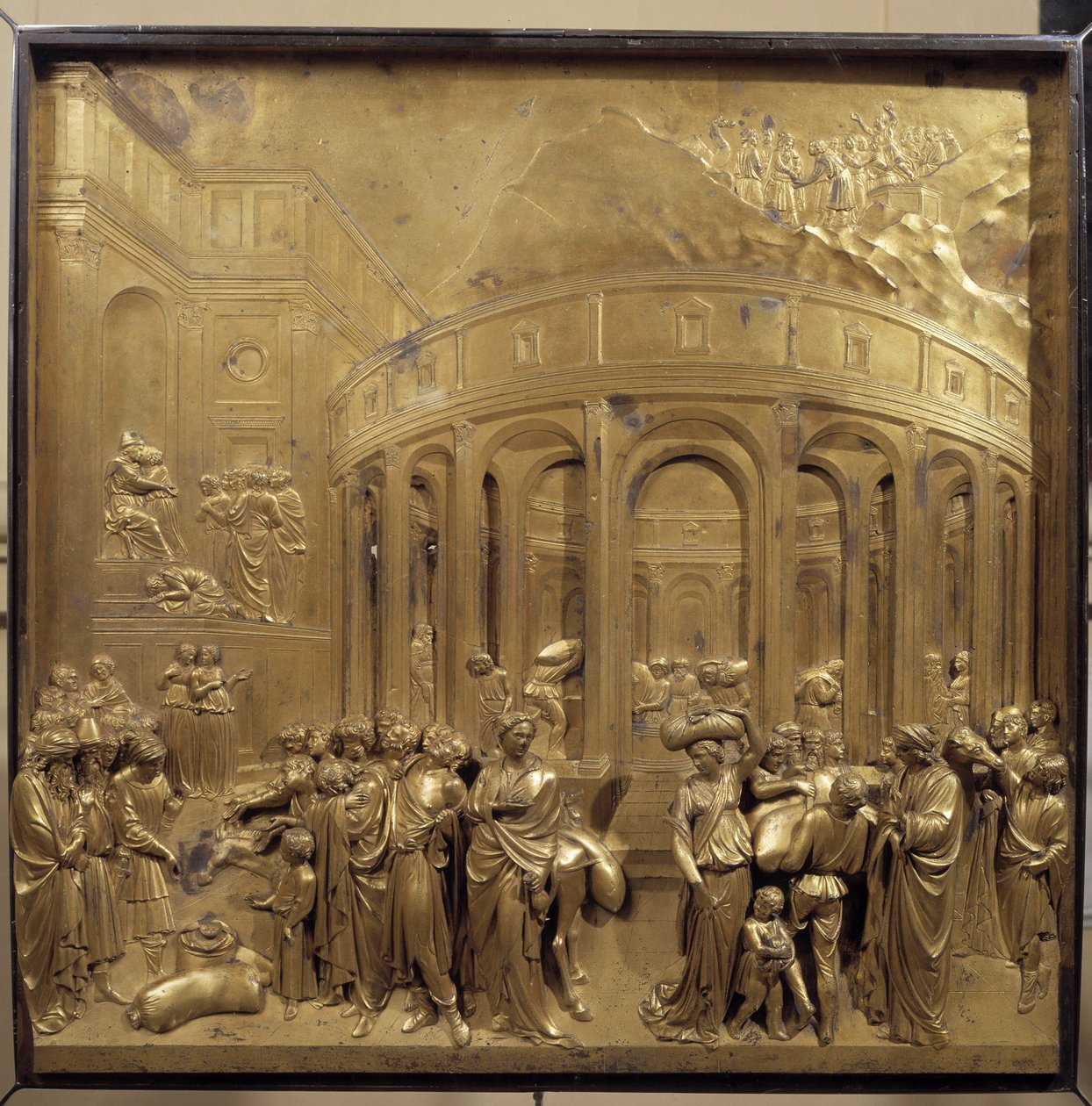 Geschiedenis van het leven van Jozef. De oogst van het graan: de boeren brengen de zakken graan. Origineel paneel van de deur van het Paradijs door Lorenzo Ghiberti