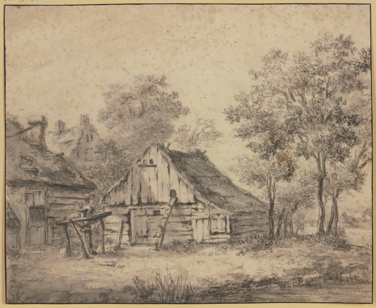 Huizen onder bomen, met een op een paal gemonteerd wiel door Meindert Hobbema