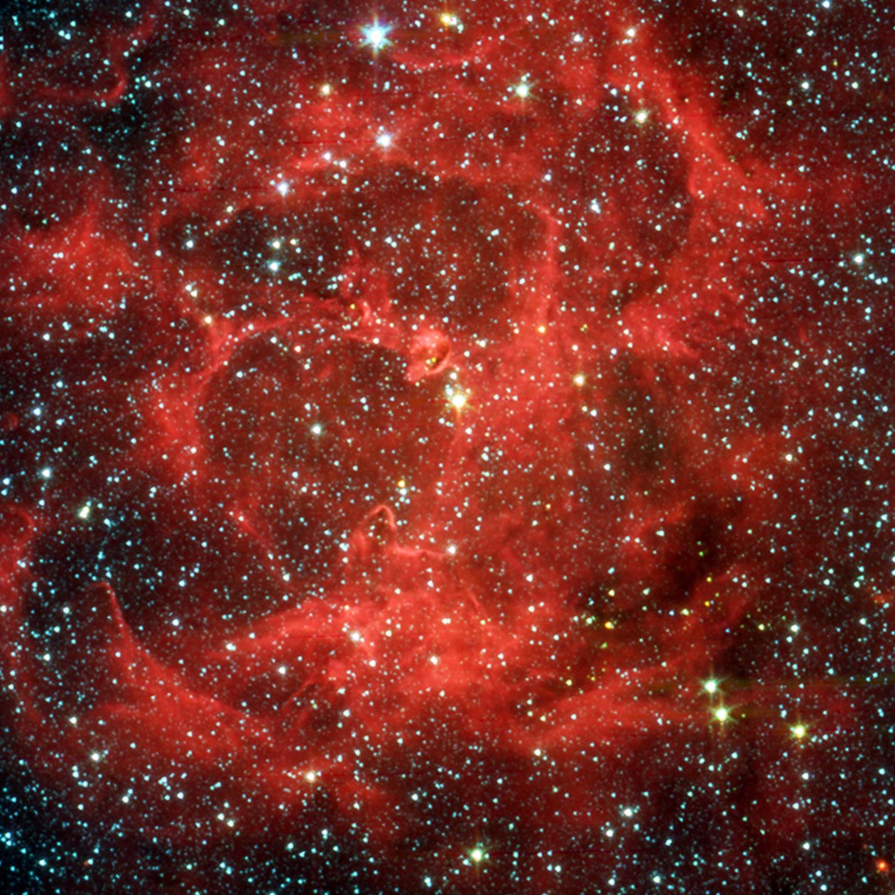 Spitzer Space Telescope vergelijkingsbeelden in zichtbaar licht en infrarood van de gloeiende Trifid-nevel, een gigantische stervormende wolk van gas en stof gelegen 5.400 lichtjaar verwijderd in de Boogschutter. door National Aeronautics and Space Administration National Aeronautics and Space Administration