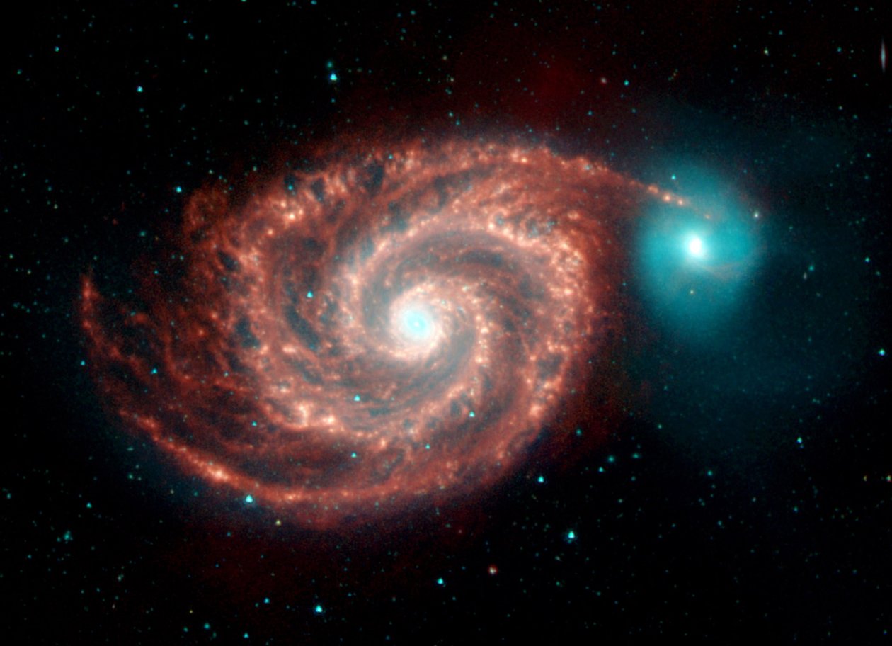 Spitzer Space Telescope infraroodbeeld van de Whirlpool Galaxy. Vreemde structuren overbruggen de gaten tussen stofrijke spiraalarmen en tonen het stof, gas en de sterrenpopulaties in de heldere spiraalgalaxie. door National Aeronautics and Space Administration National Aeronautics and Space Administration