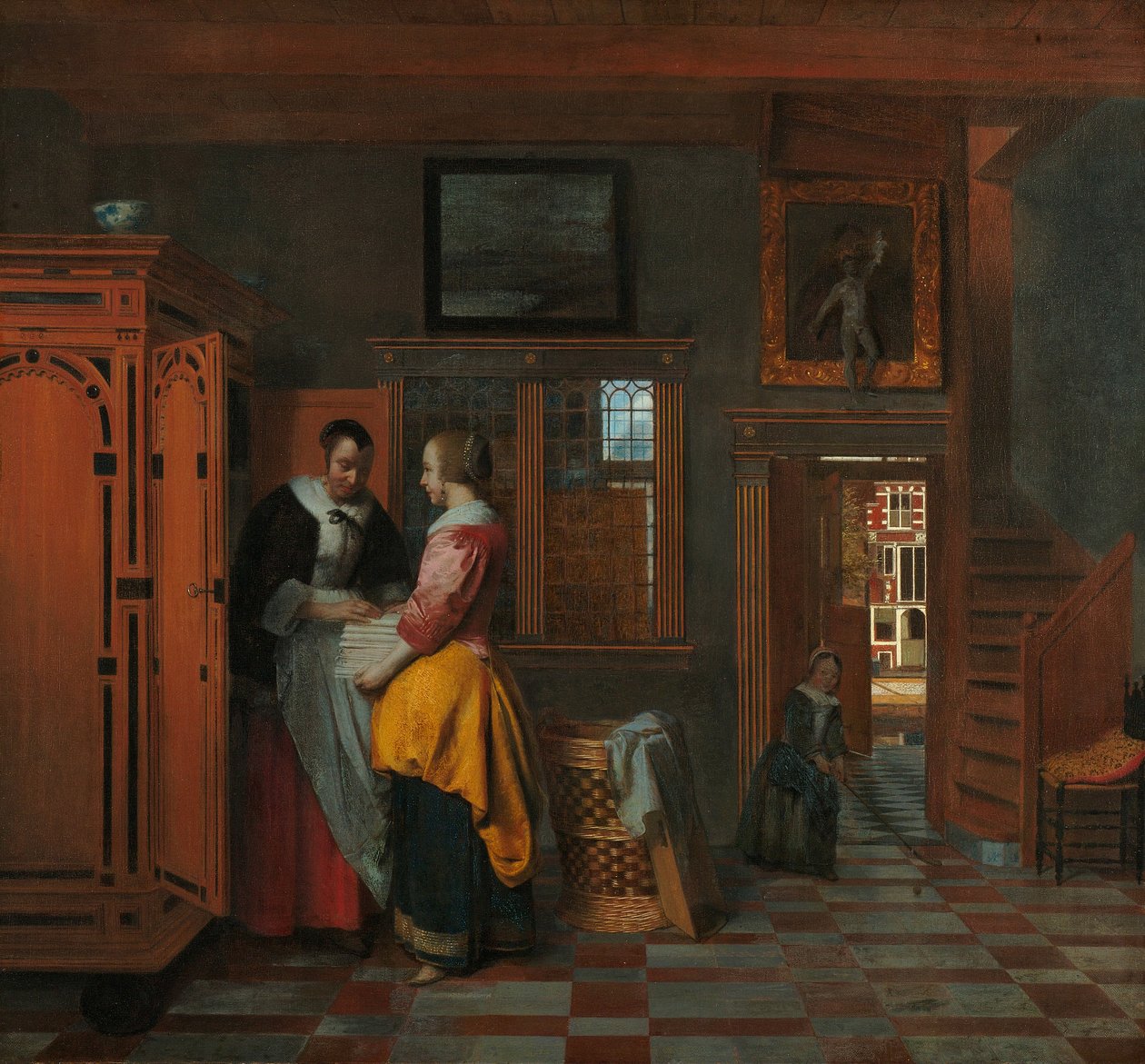 Interieur met vrouwen naast een linnenkast door Pieter de Hooch