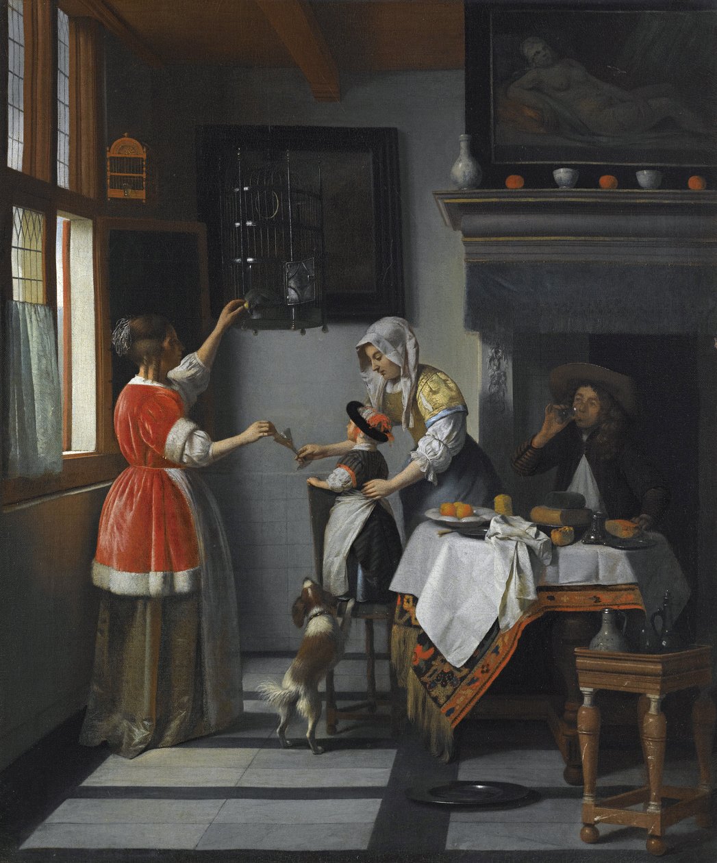 Interieur met een kind dat een papegaai voedt door Pieter de Hooch