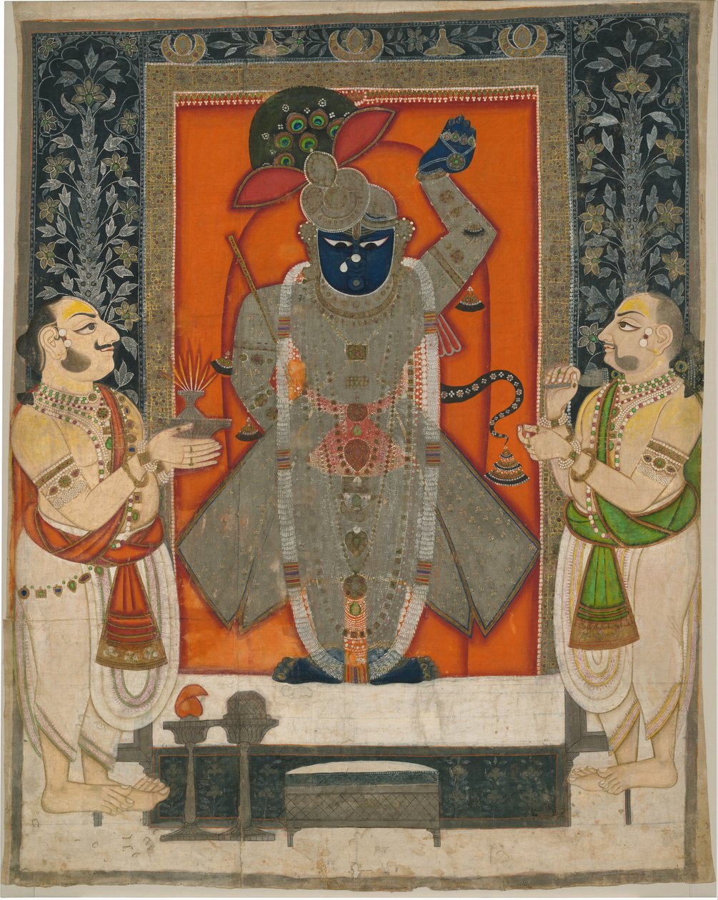 Priesters die Krishna aanbidden als Shrinathji voor het Voedselfestival [Annakuta utsava]; tempelkleed [pichhavai] door Rajasthan Kota school