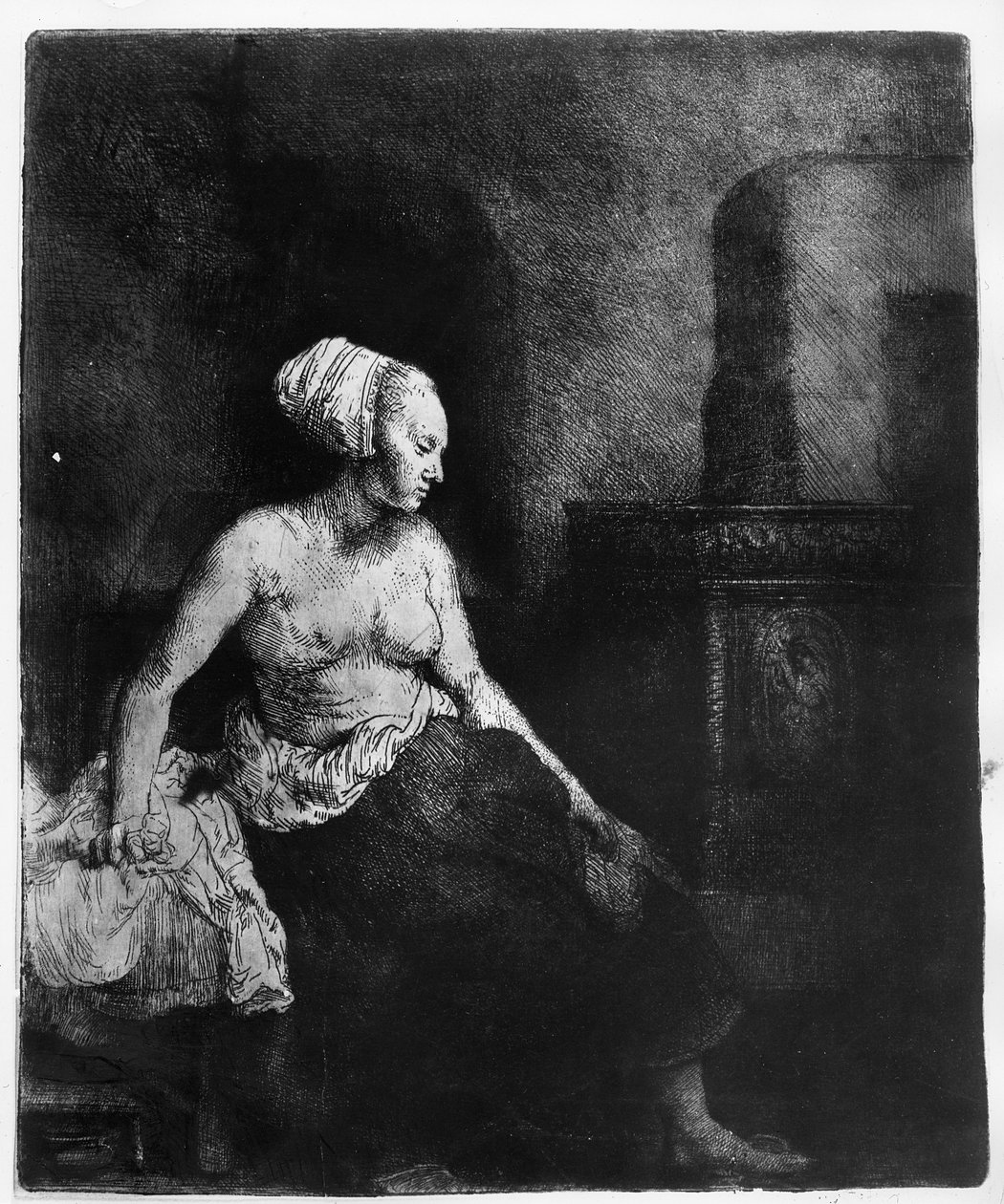 Vrouw die halfgekleed naast een kachel zit, 1658 door Rembrandt van Rijn