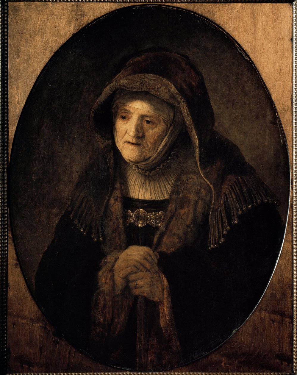 Portret van de moeder van de kunstenaar leunend op haar stok door Rembrandt van Rijn