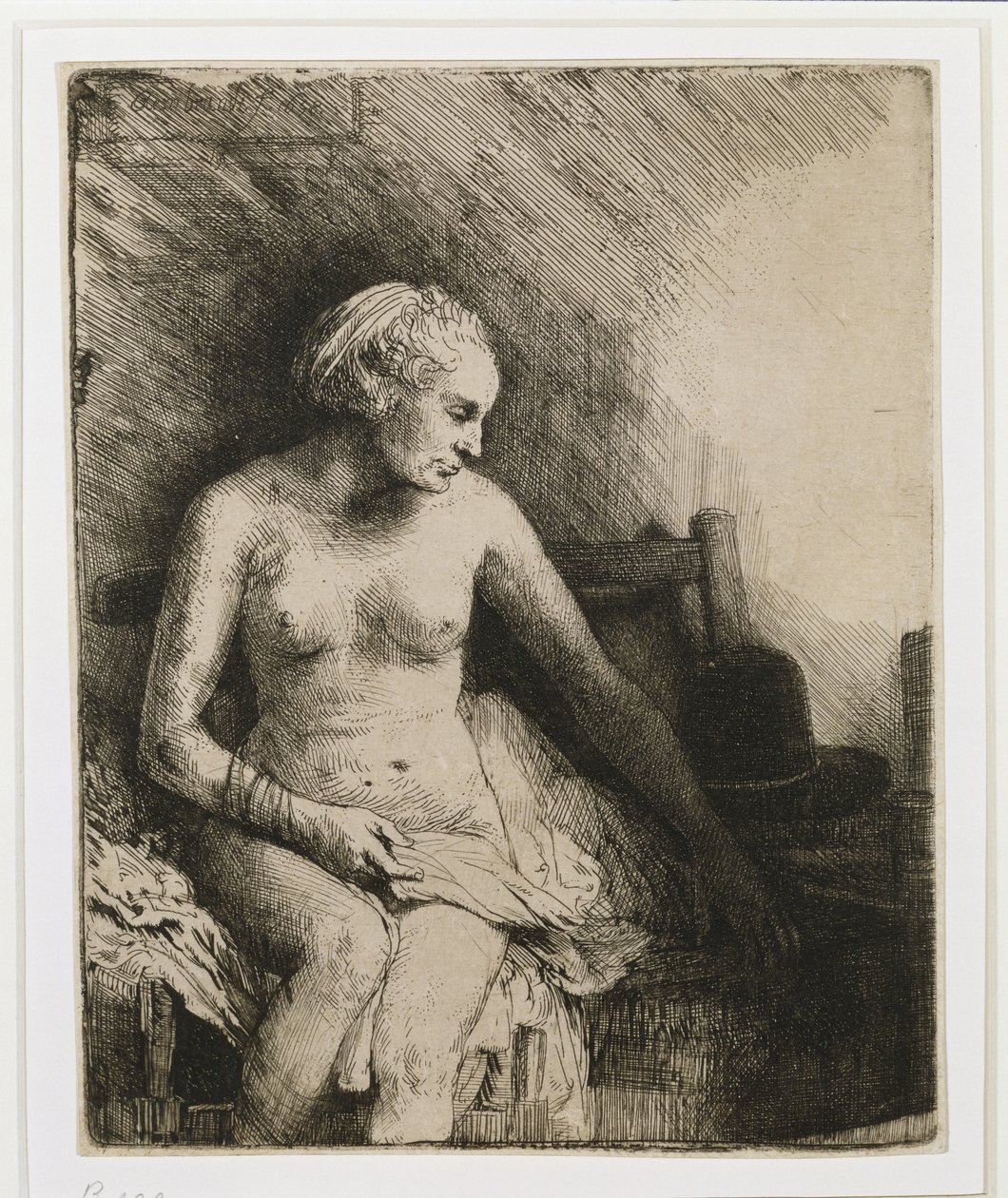 Een Vrouw bij het Bad met een Hoed naast Haar, 1658 door Rembrandt van Rijn