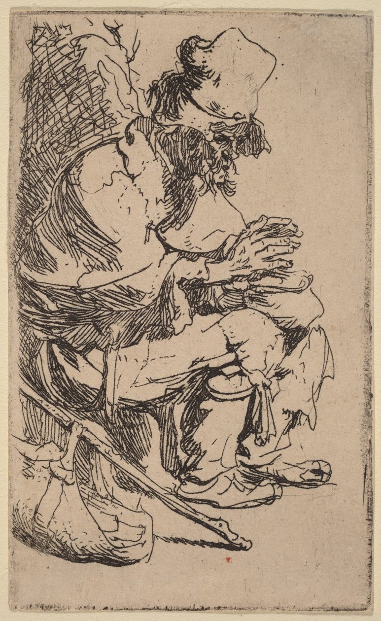Een bedelaar die zit en zijn handen warmt aan een warmhoudpan door Rembrandt van Rijn
