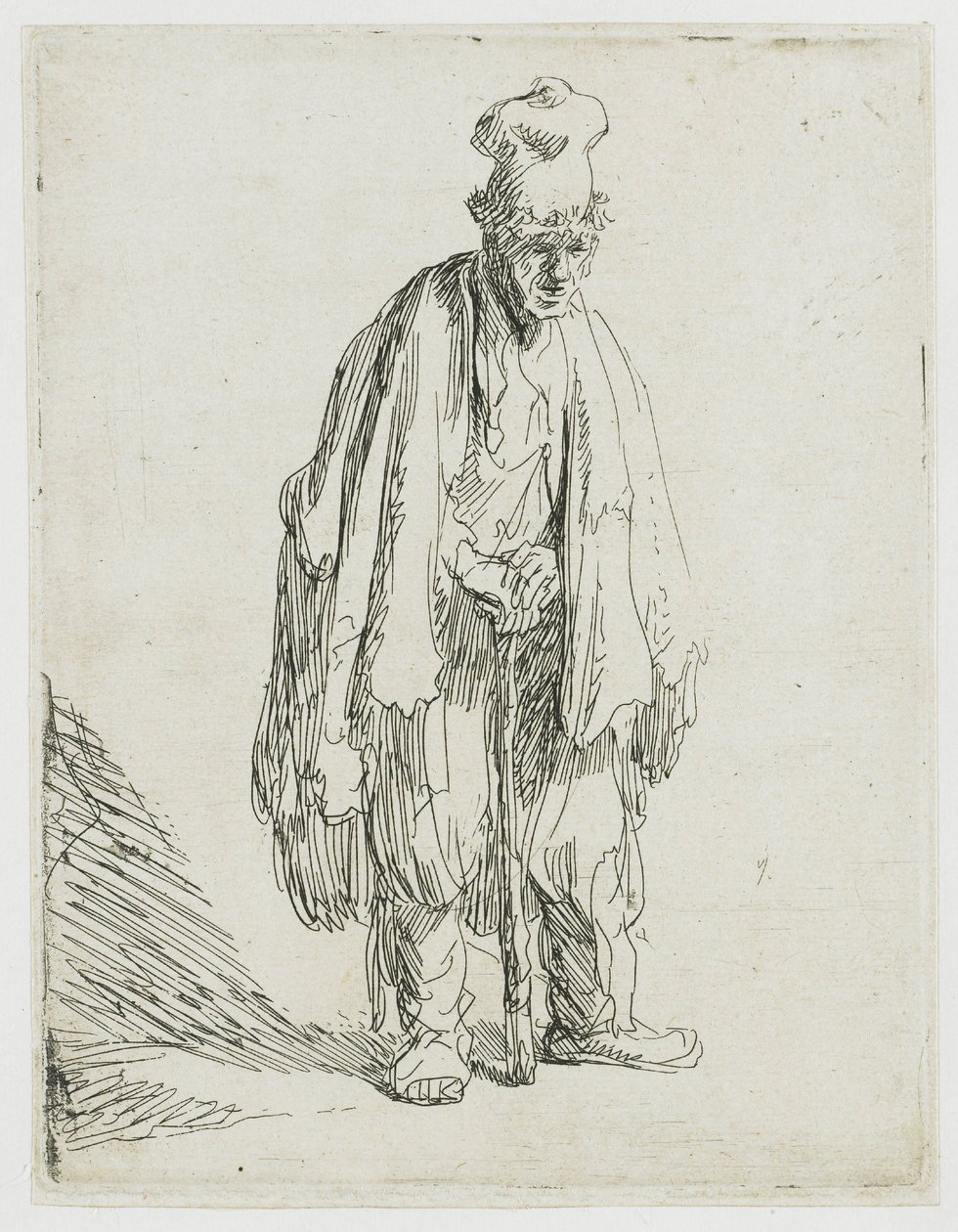 Een bedelaar met een hoge pet, staand en leunend op een stok door Rembrandt van Rijn