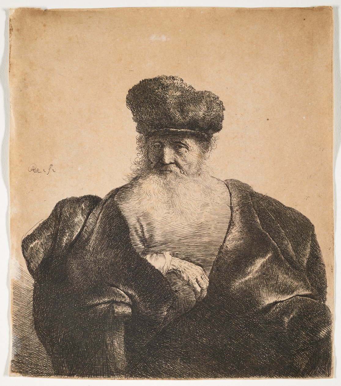 Oude man met baard, bontmuts en fluwelen mantel door Rembrandt van Rijn