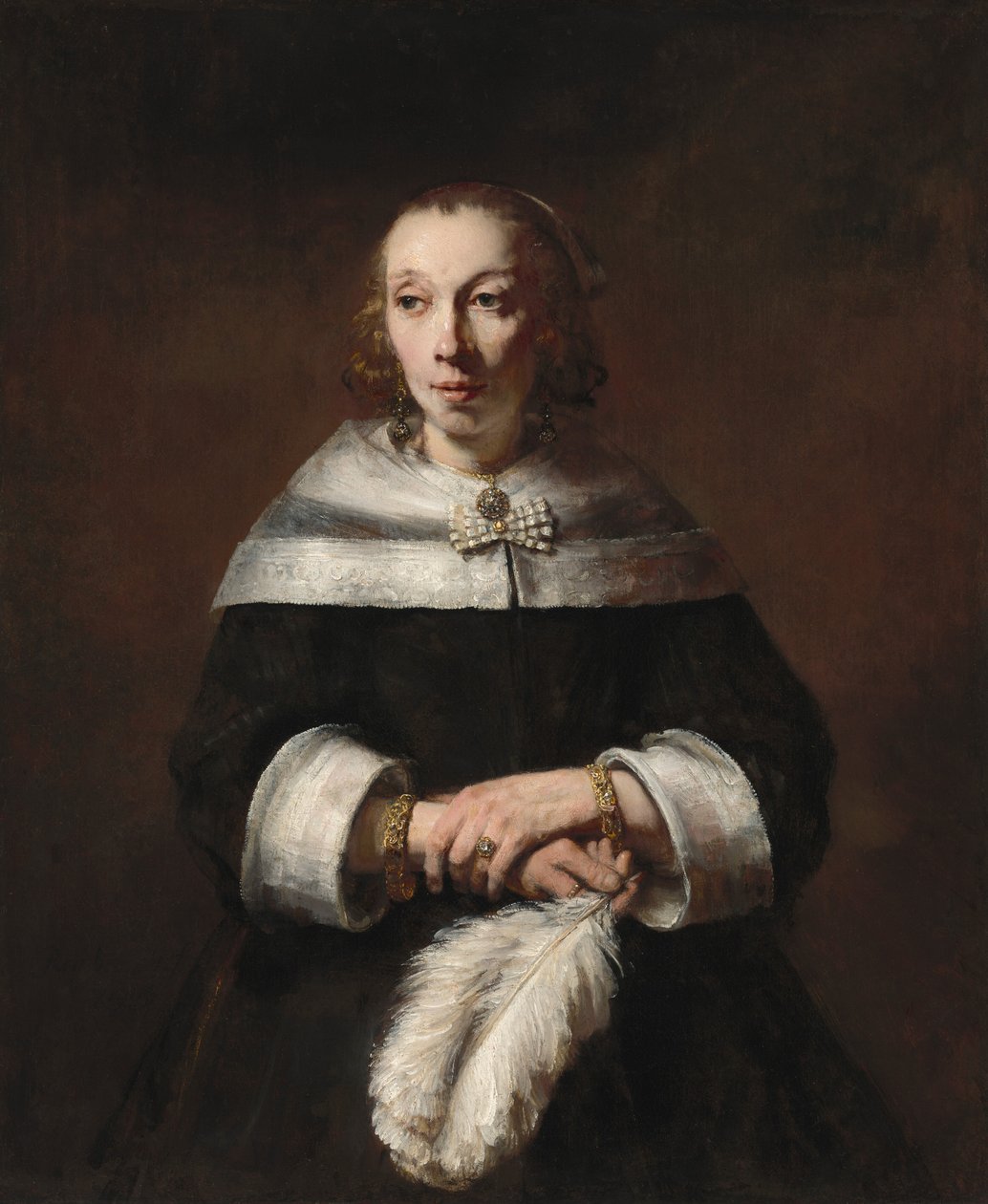 Portret van een dame met een struisvogelveren waaier, ca. 1656-1658 door Rembrandt van Rijn