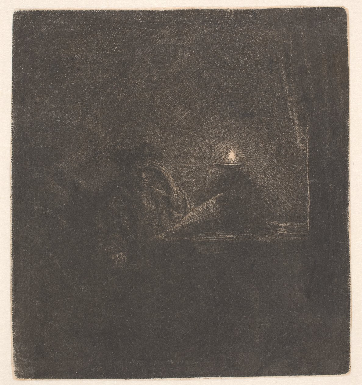 Een student aan een tafel bij kaarslicht door Rembrandt van Rijn