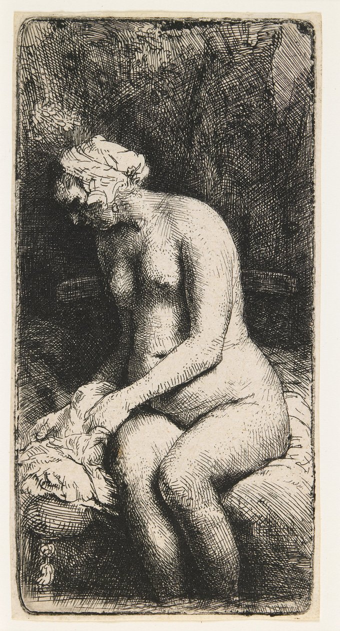 Vrouw die haar voeten baadt in een beek door Rembrandt van Rijn