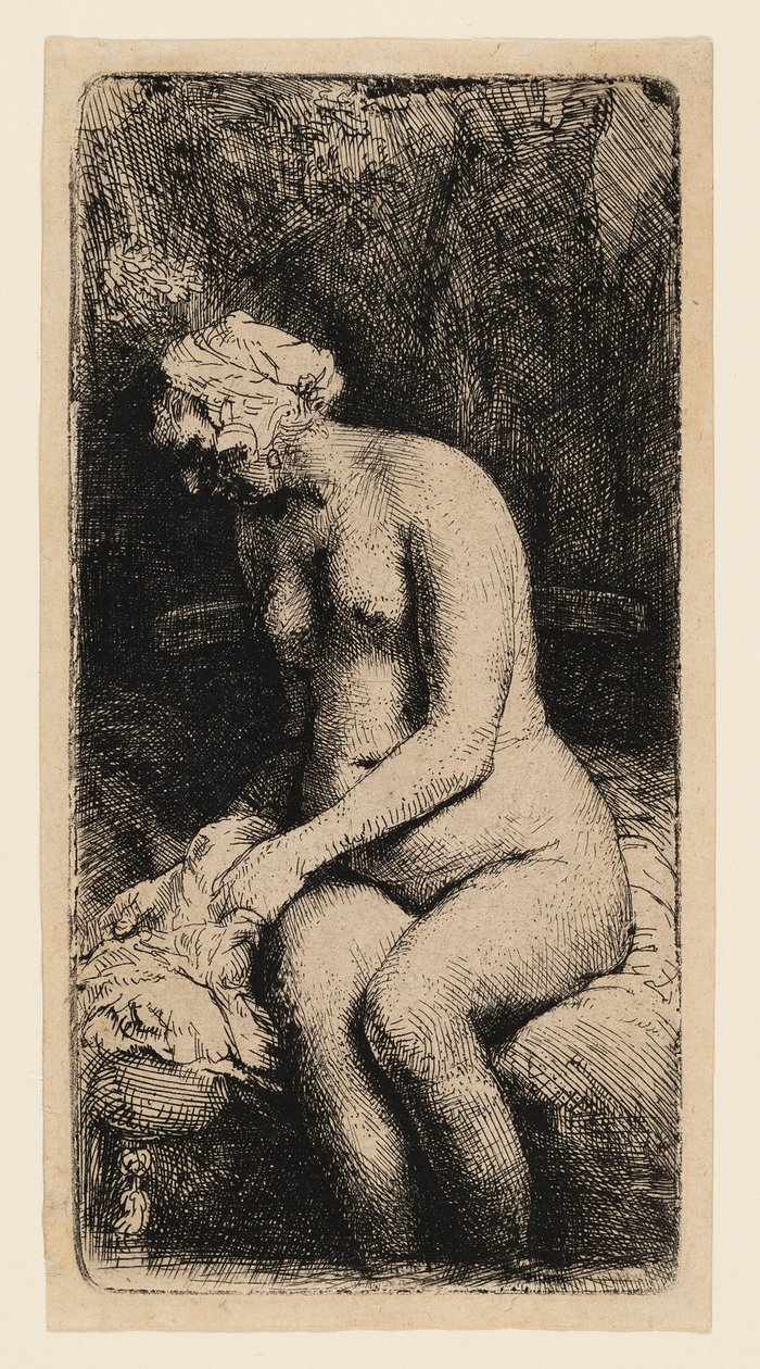 Vrouw die haar voeten wast in een beek door Rembrandt van Rijn