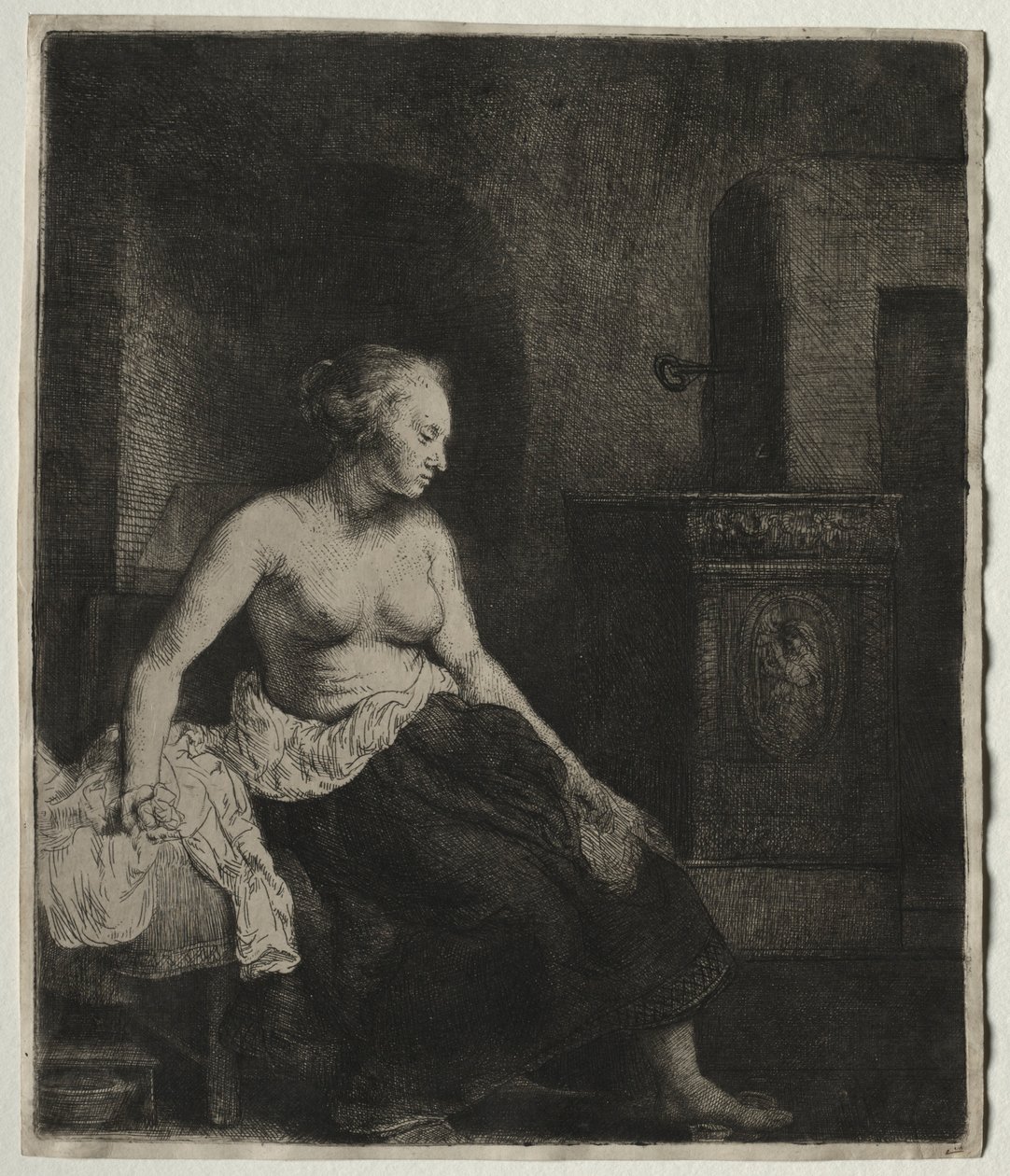 Vrouw die half aangekleed naast een kachel zit, 1658 door Rembrandt van Rijn