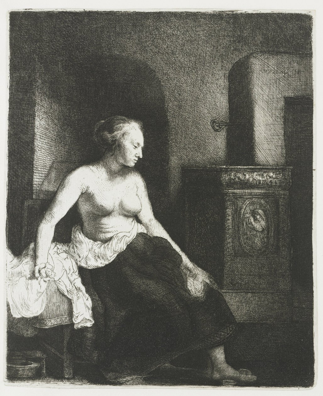 Zittende half aangeklede vrouw naast een kachel door Rembrandt van Rijn