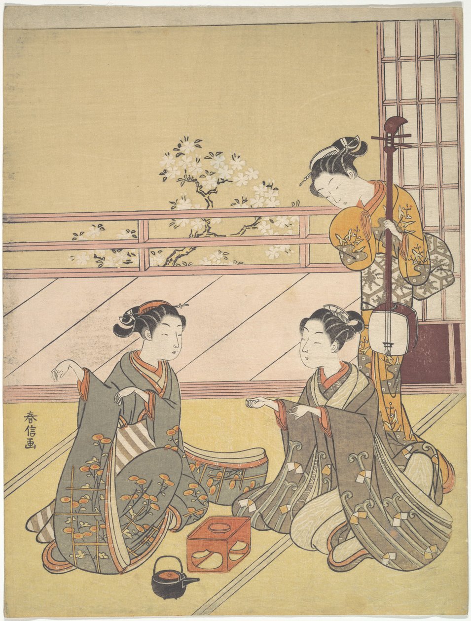 Jonge vrouwen die kitsune-ken spelen (vossenspel) door Suzuki Harunobu