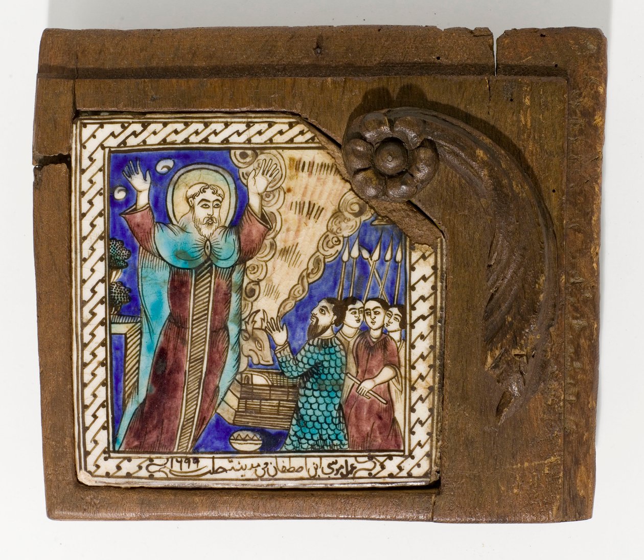 Een gesigneerde en gedateerde Syrische keramische tegel, geschilderd in mangaan, blauw en bruin, gedateerd 1699, 1699 door Syrian School