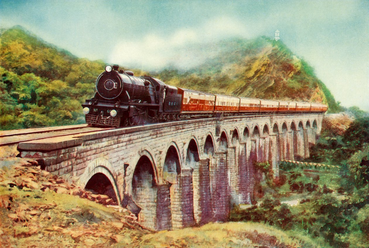 Tussen Bombay en Delhi. Een opvallend uitzicht op de Frontier Mail die over een viaduct passeert, 1935 door Unbekannt