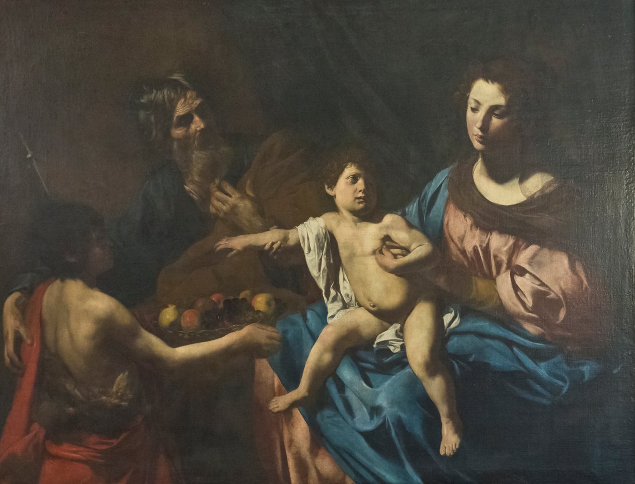Heilige familie met jonge Sint Johannes de Doper door Valentin de Boulogne