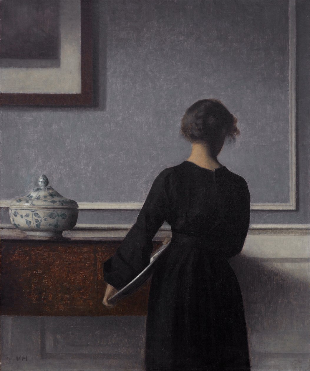Interieur met jonge vrouw van achteren door Vilhelm Hammershøi