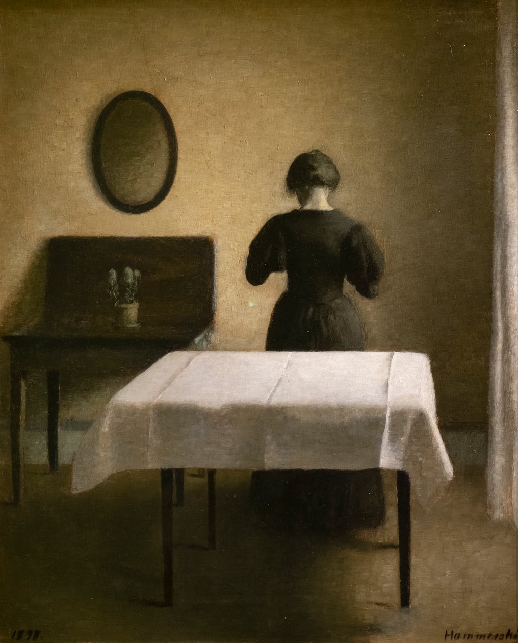 Interieur met een zwarte vrouw door Vilhelm Hammershoi
