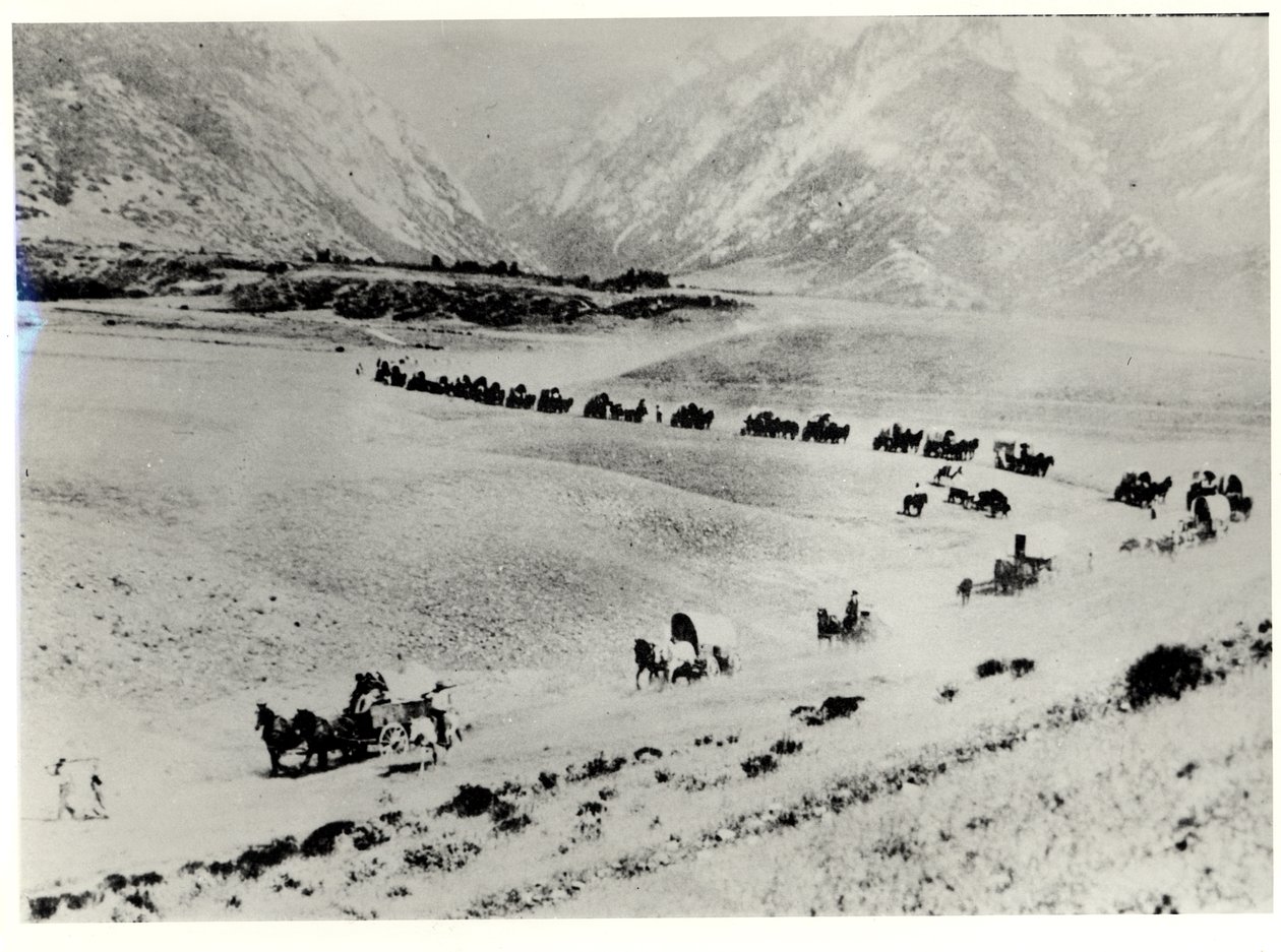 Pioniers die immigranten van het treinstation ophalen en naar de Mormoonse Salt Lake City leiden door William Henry Jackson